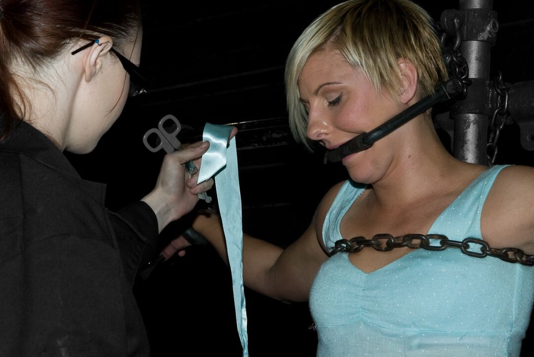 17P Blonde female Vendetta is topped by Claire Adams in a maternity bra