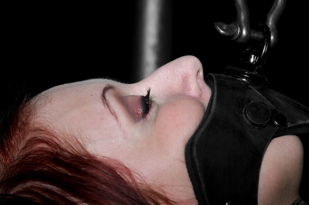 19P Redheaded MILF Sabrina Sparx gets stripped while tied to a metal construction