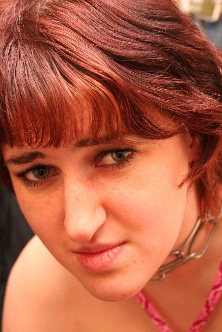 16P Redhead female is spanked after being covered in candle wax