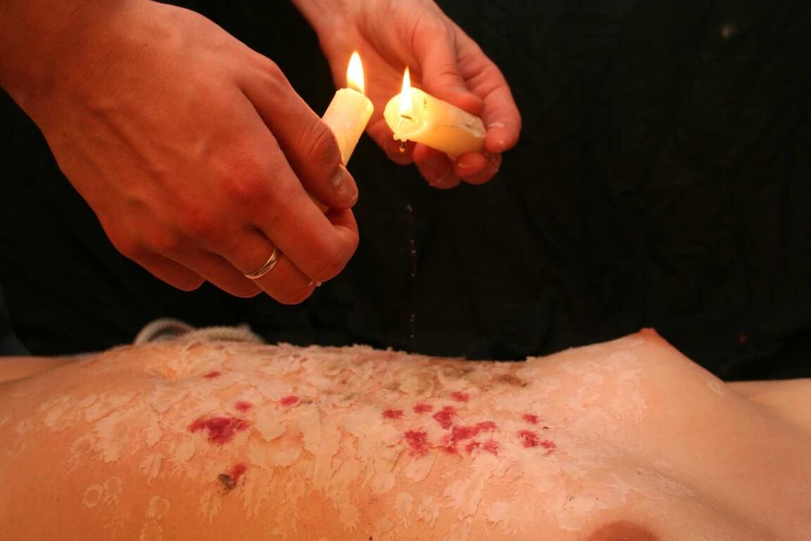 16P Redhead female is spanked after being covered in candle wax