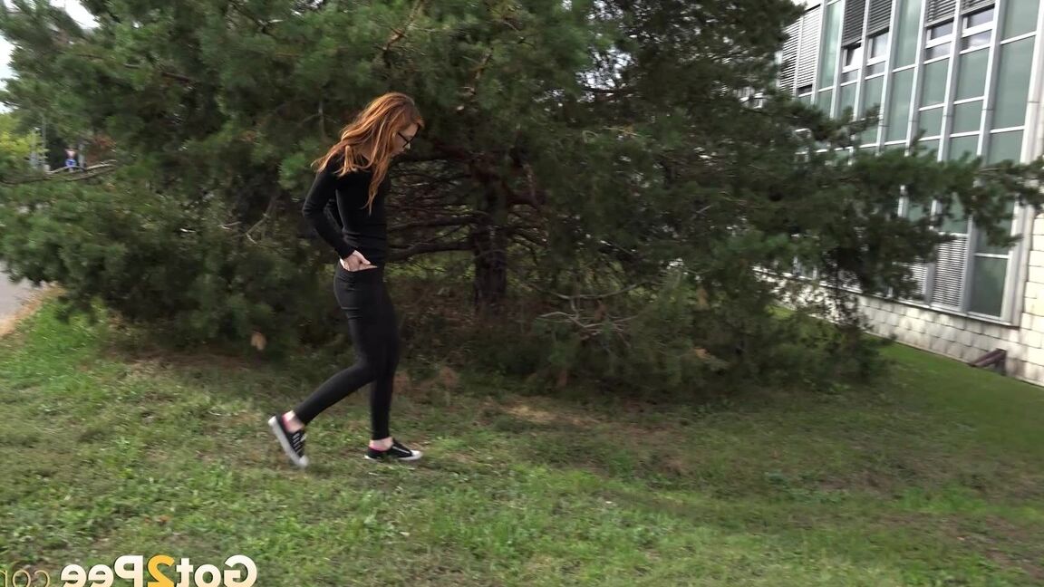 15P Black clad Sandra in glasses pauses to pee behind some trees on the street
