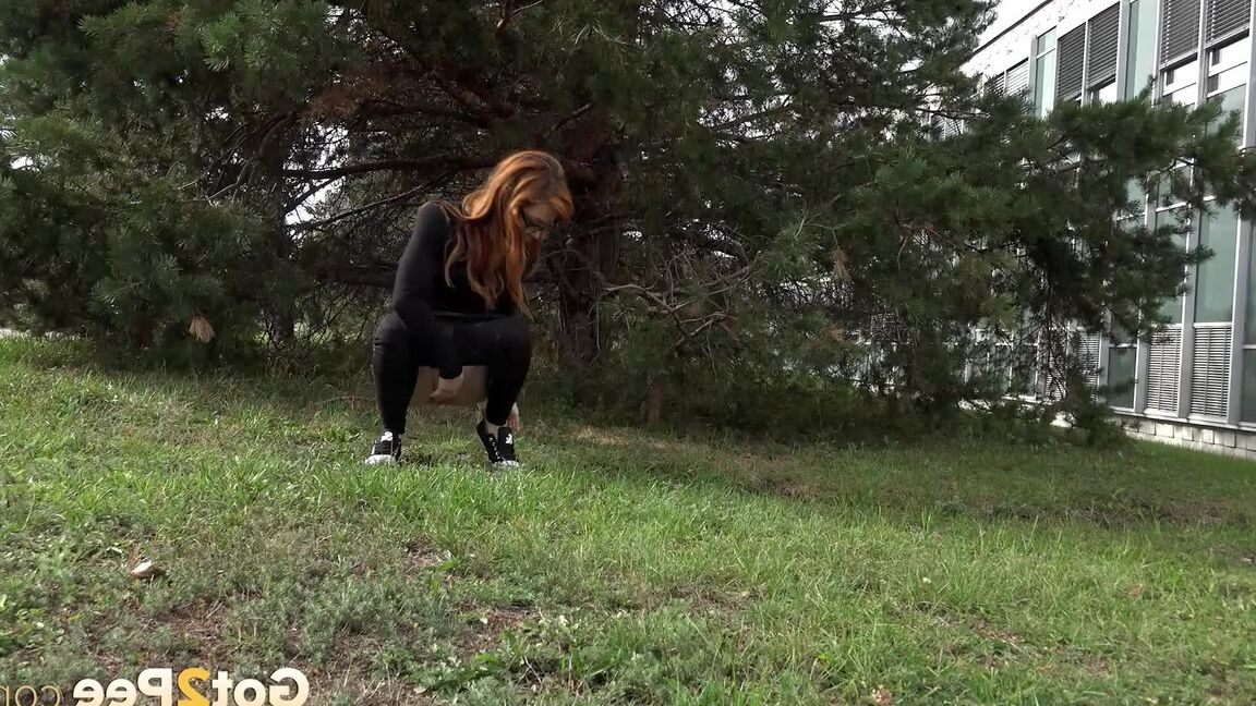 15P Black clad Sandra in glasses pauses to pee behind some trees on the street