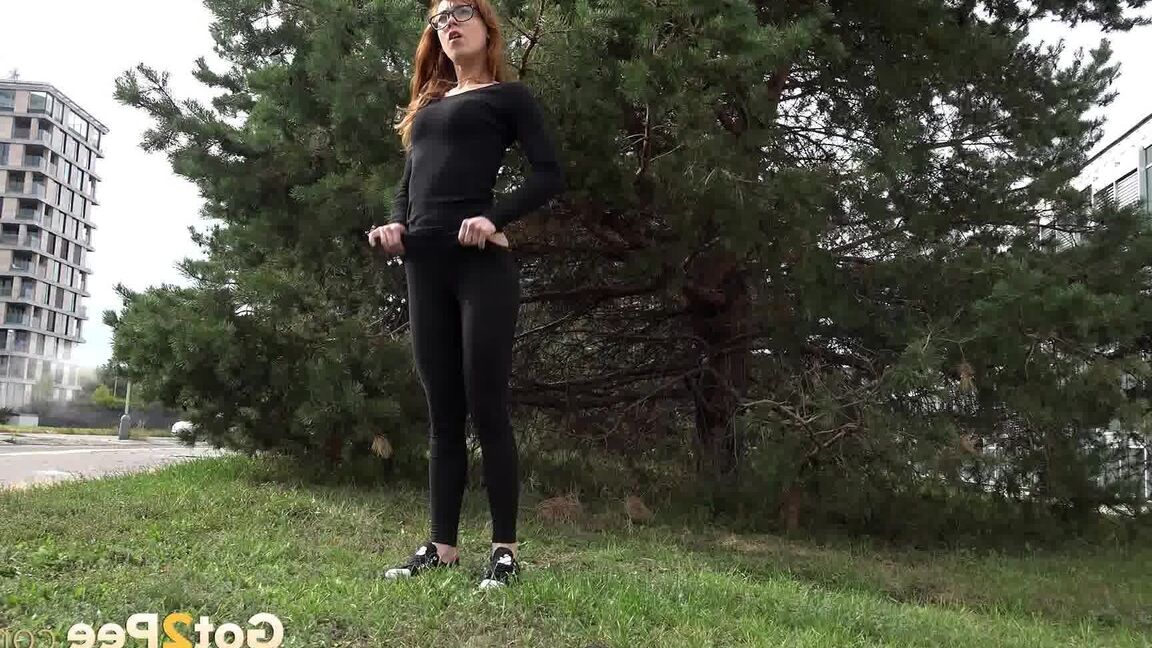 15P Black clad Sandra in glasses pauses to pee behind some trees on the street