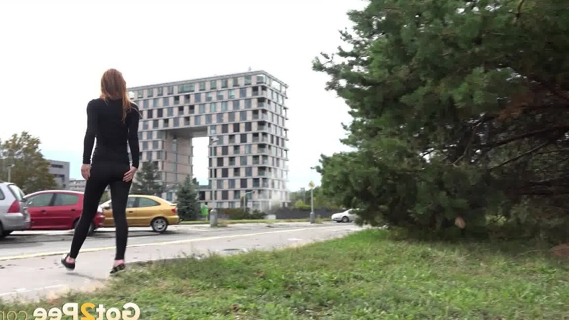 15P Black clad Sandra in glasses pauses to pee behind some trees on the street