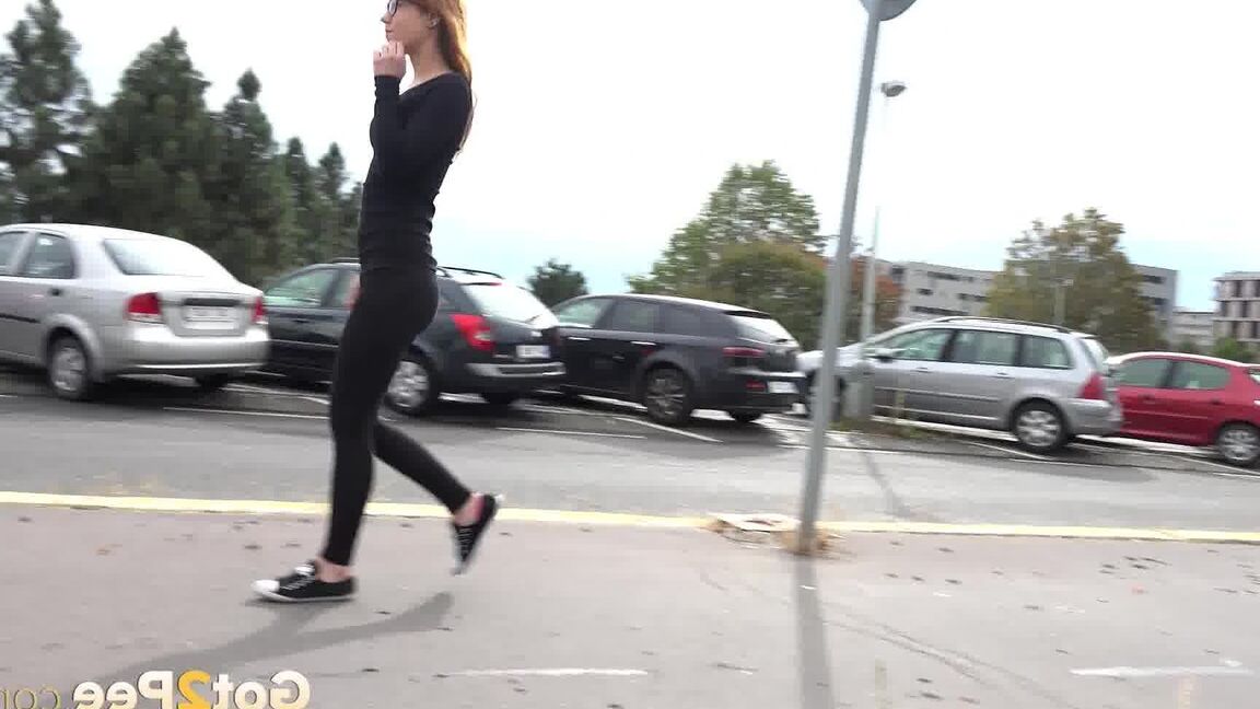 15P Black clad Sandra in glasses pauses to pee behind some trees on the street