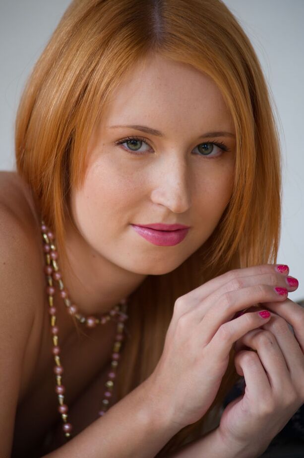 16P Pale redhead Nikky B casts aside her see thru lingerie for nude posing