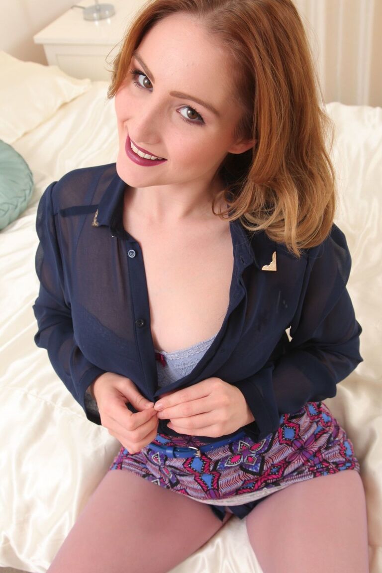 21P Ginger Rachelle removes clothes and high heels before posing in purple tights