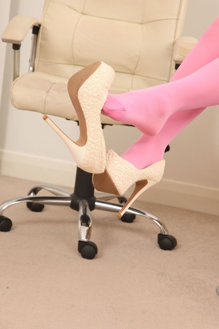 21P Busty cutie Erica stripping to pink stockings and posing topless at work