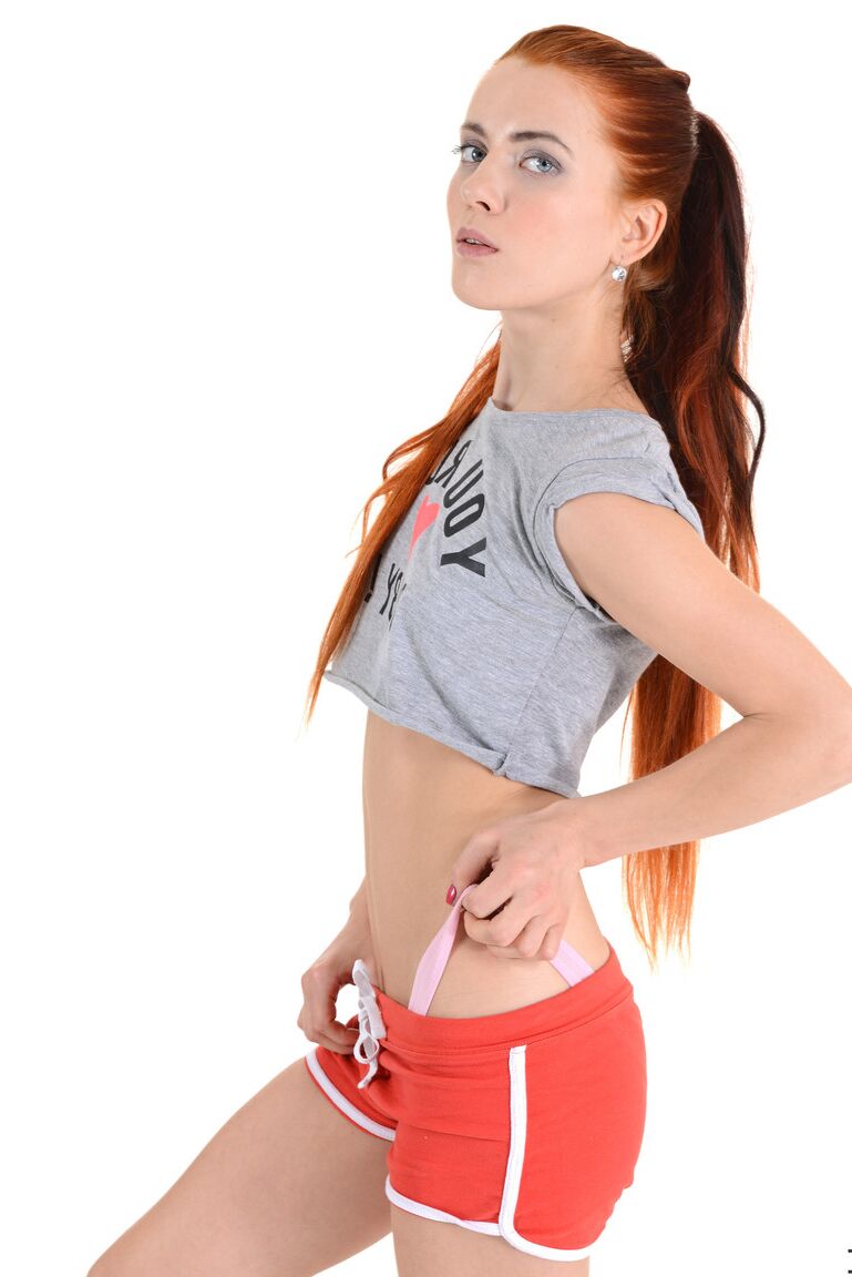 15P Pale redhead Katrina tugs on her long ponytails after stripping naked
