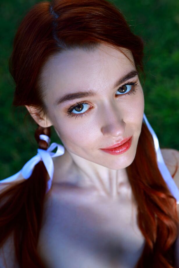 18P Young redhead Sherice pauses a badminton game to show her tight slit on grass