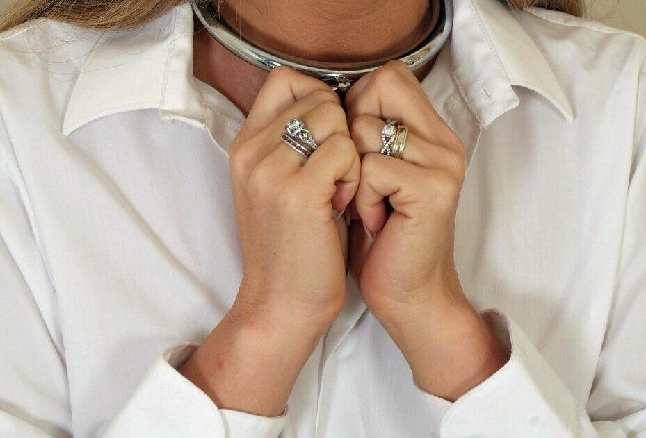 16P Collared British woman Natalia Forrest has her hands cuffed behind her back