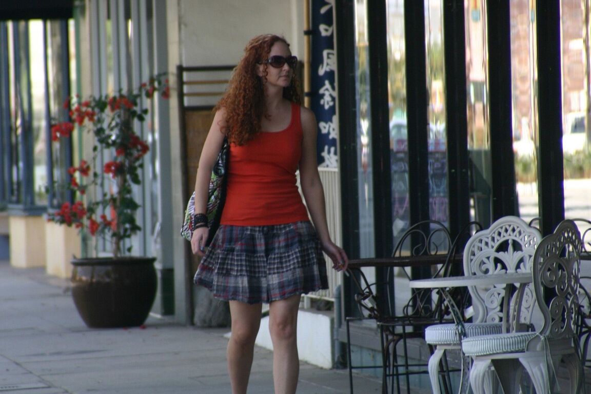 17P Redhead vixen Kitty Caulfield shows long legs in a short skirt in public