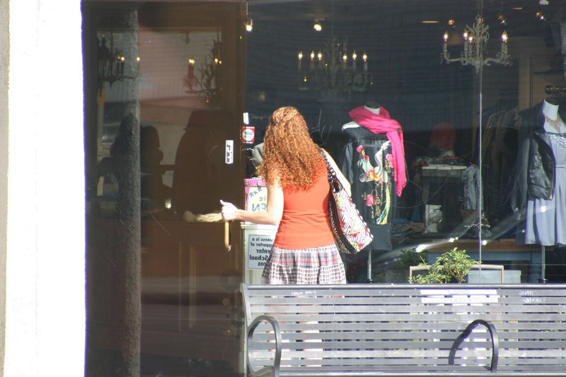 17P Redhead vixen Kitty Caulfield shows long legs in a short skirt in public