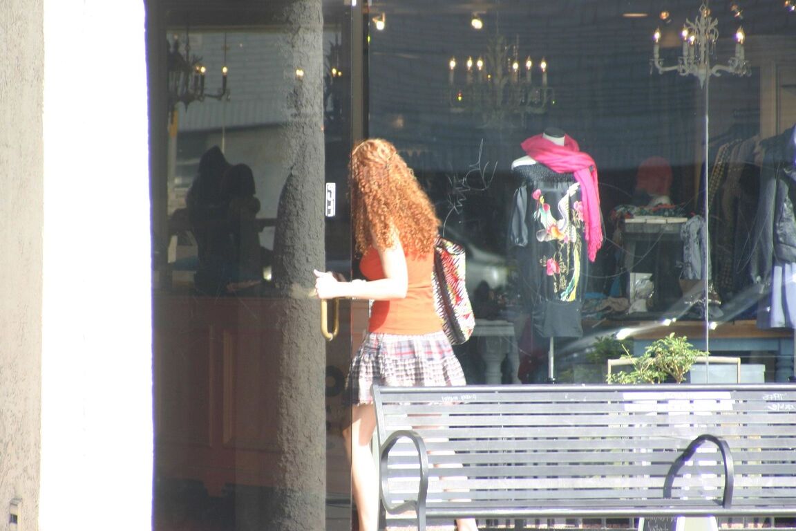 17P Redhead vixen Kitty Caulfield shows long legs in a short skirt in public