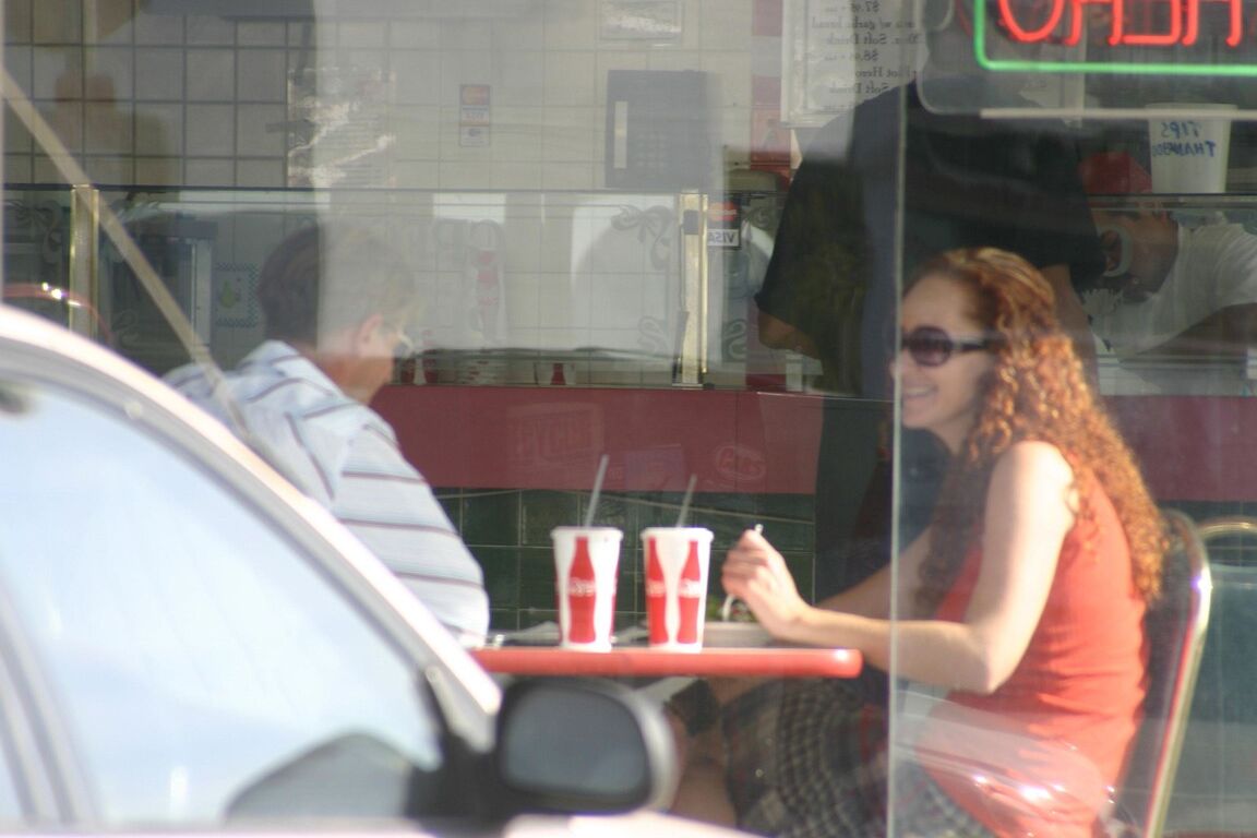 17P Redhead vixen Kitty Caulfield shows long legs in a short skirt in public