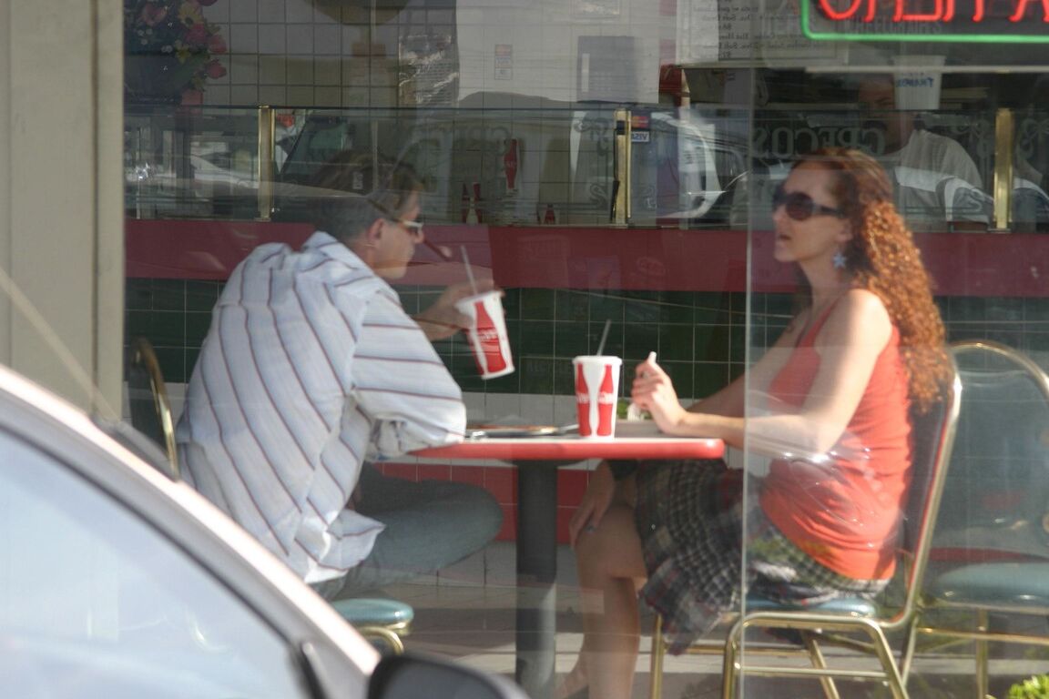 17P Redhead vixen Kitty Caulfield shows long legs in a short skirt in public