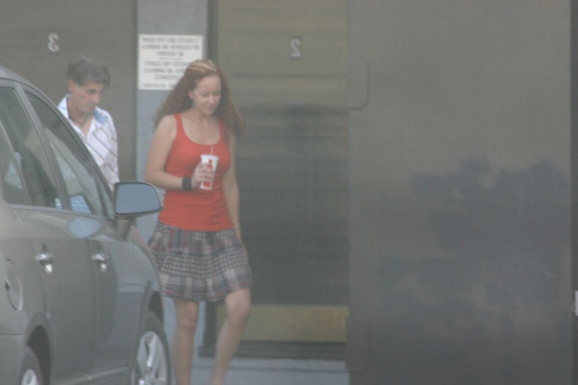 17P Redhead vixen Kitty Caulfield shows long legs in a short skirt in public