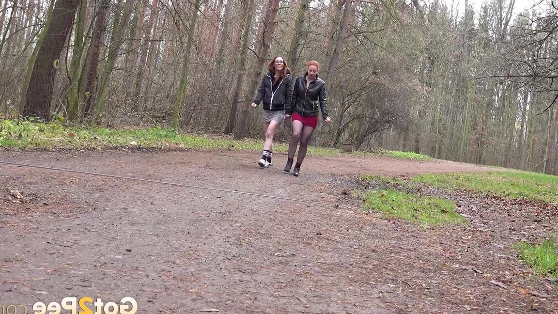 15P 2 redheads squat for a piss while taking a walk on a dirt road