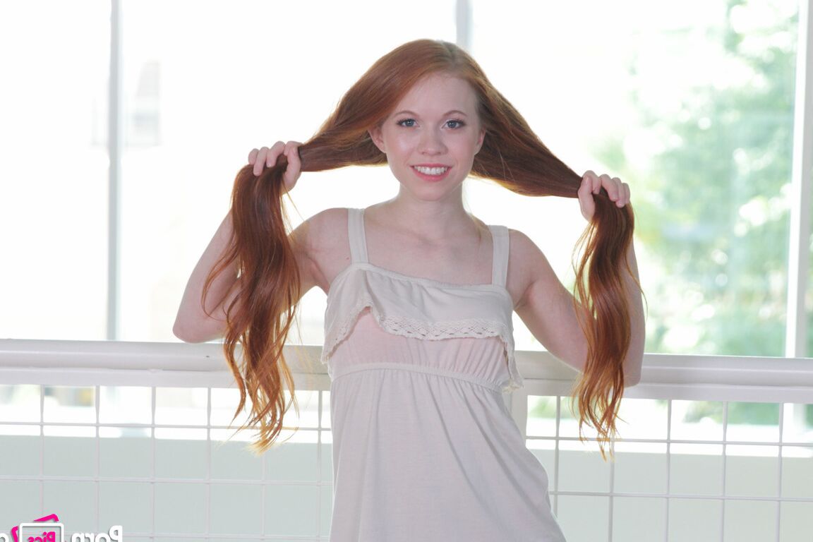 17P Foxy redhead Dolly Little stripping and playing with her pussy lips