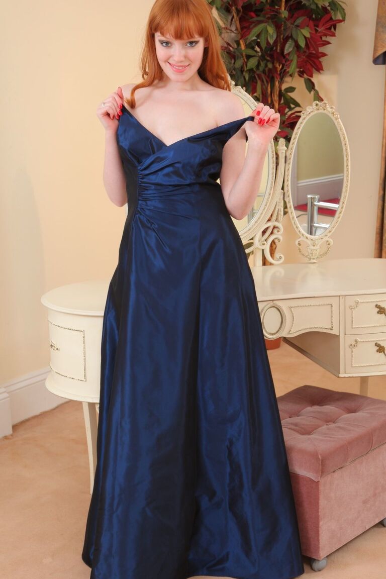 21P Redhead beauty Charlie E taking off her elegant dress and panties