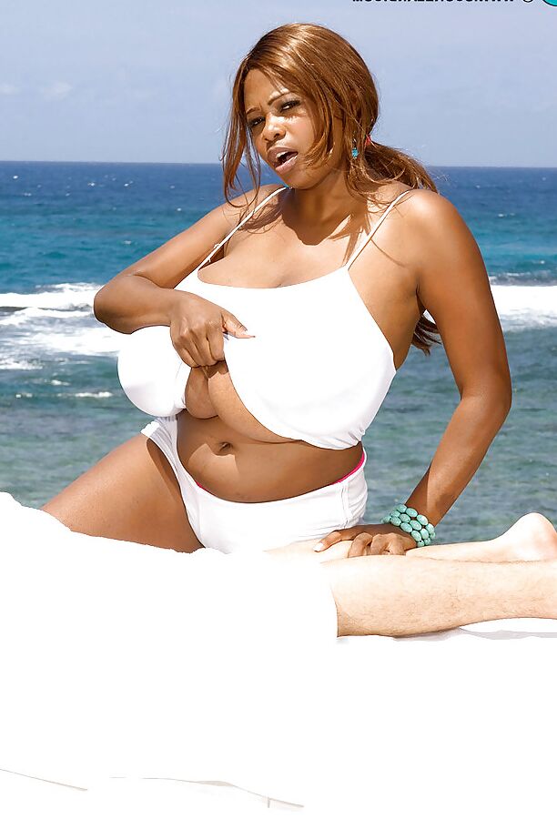 16P Huge melloned ebony lady loves showing off her breasts outdoors by the beach as she makes out and shags with a hung stud.