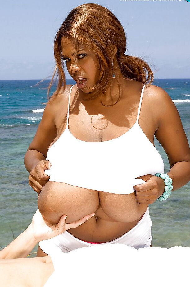 16P Huge melloned ebony lady loves showing off her breasts outdoors by the beach as she makes out and shags with a hung stud.