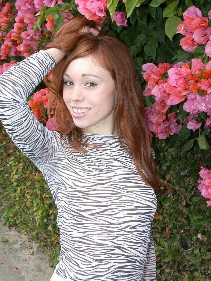 15P Pale redheaded teen shows her tits and twat during a beach stroll