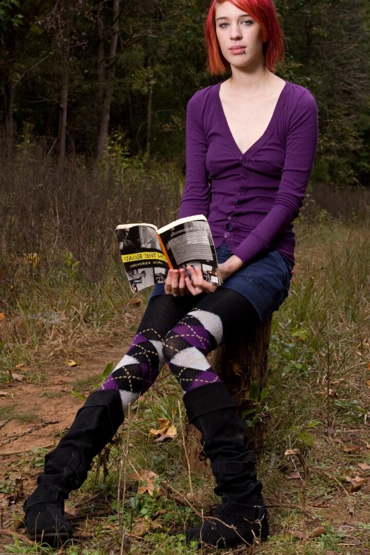 15P Redhead chick exposes upskirt pussy and tits while sitting on a stump
