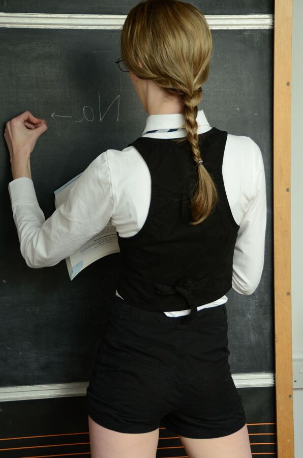 15P Schoolgirl Melissa Thompson stands at the chalkboard after stripping naked