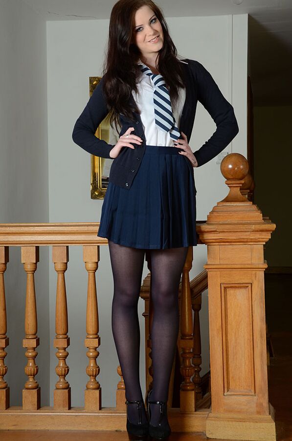 15P Tall girl Jessica-Ann Fegan peels off her school uniform on a landing