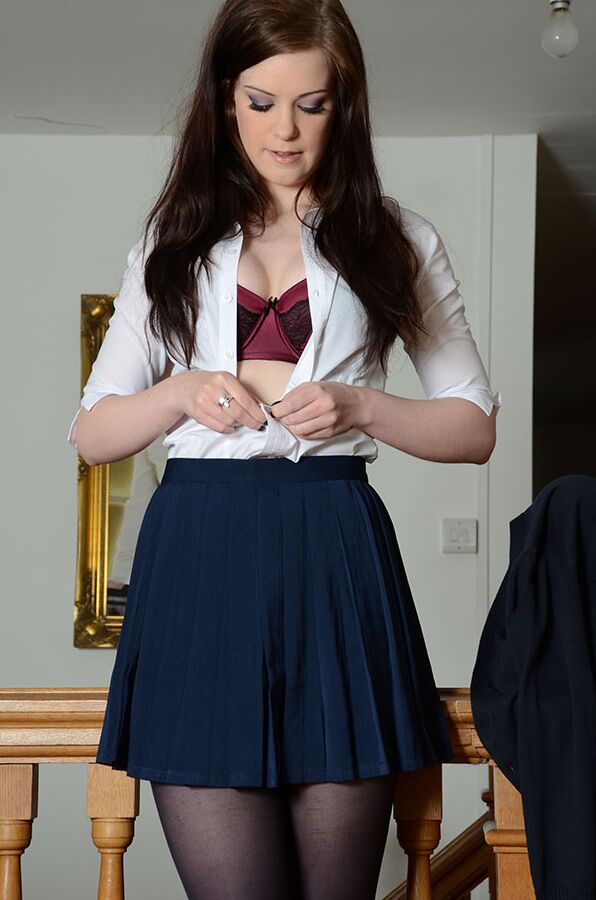 15P Tall girl Jessica-Ann Fegan peels off her school uniform on a landing