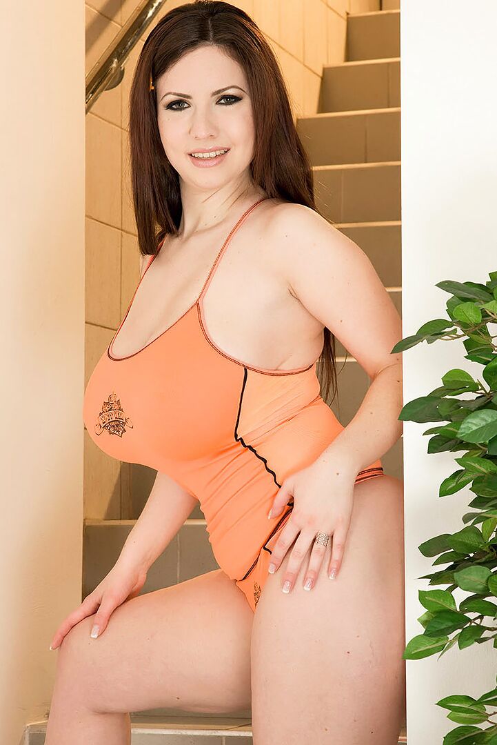 17P Curvaceous solo model Karina Hart unleashes her hooters in thong underwear