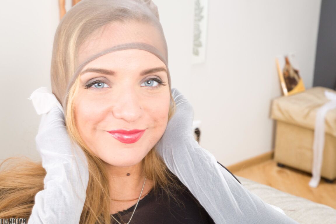 16P Solo model Sofi Goldfinger dresses herself in multiple layers of pantyhose