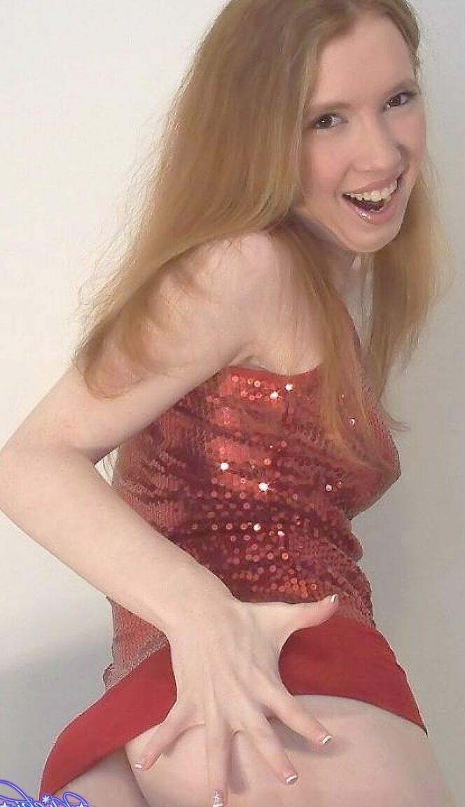 17P Shy redhead Nicki Blue posing in front of the camera in sexy lingerie
