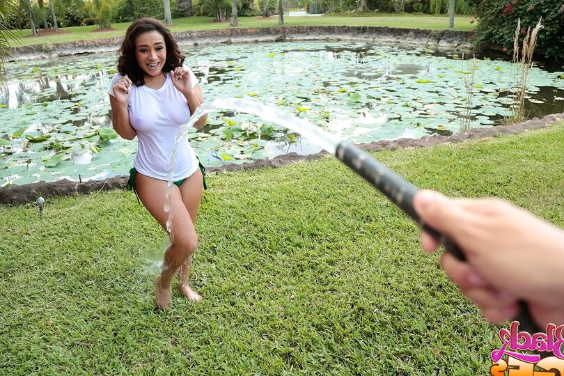 12P Busty Latina wets herself down in the fountain wearing a white t-shirt