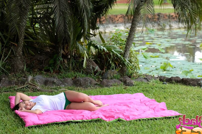 12P Busty Latina wets herself down in the fountain wearing a white t-shirt