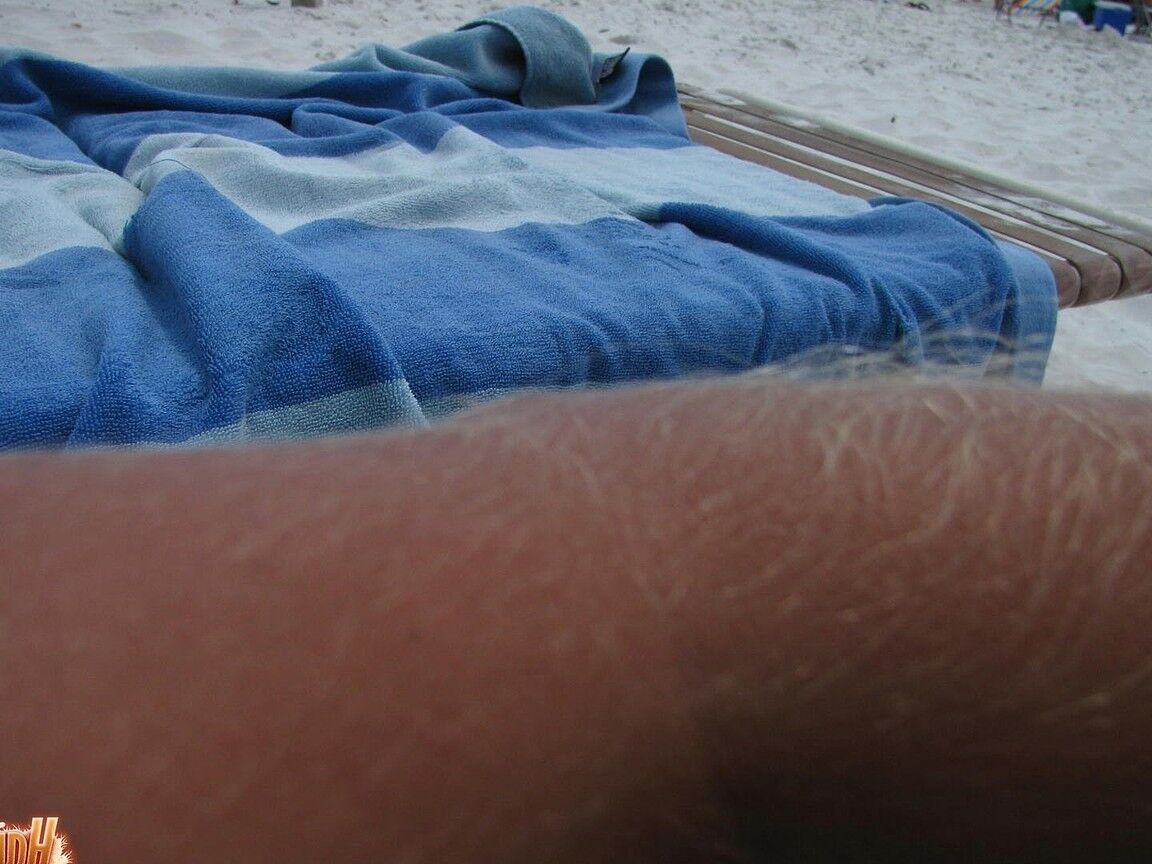 21P Skinny MILF Lori Anderson showing her hairy arms while relaxing on the beach