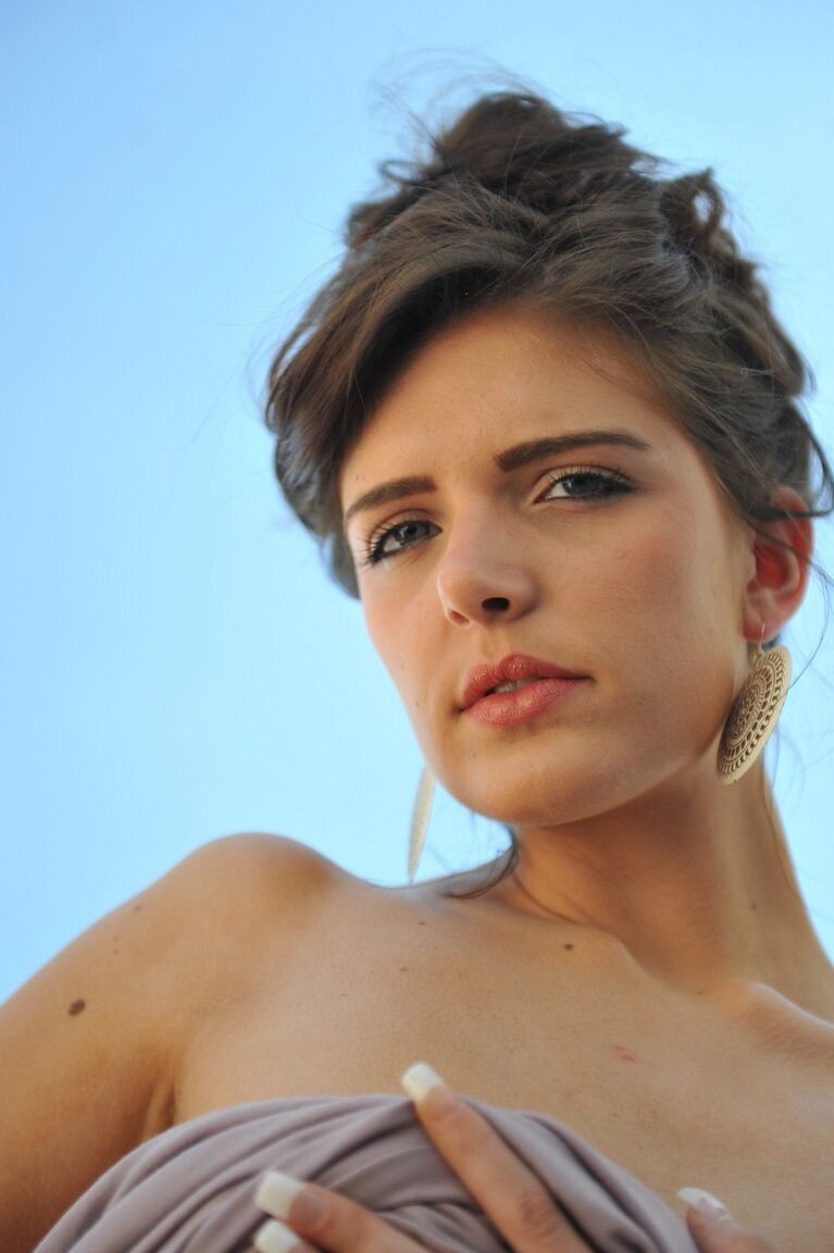 12P British model Lucy Blackburn slides her underwear aside on a balcony