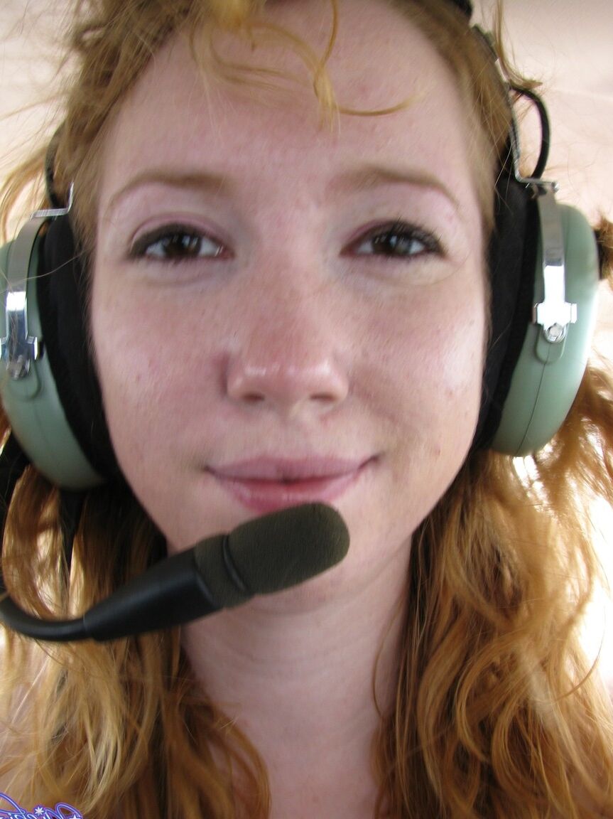 15P Natural redhead Nicki Blue gets totally naked aboard a small engine aircraft