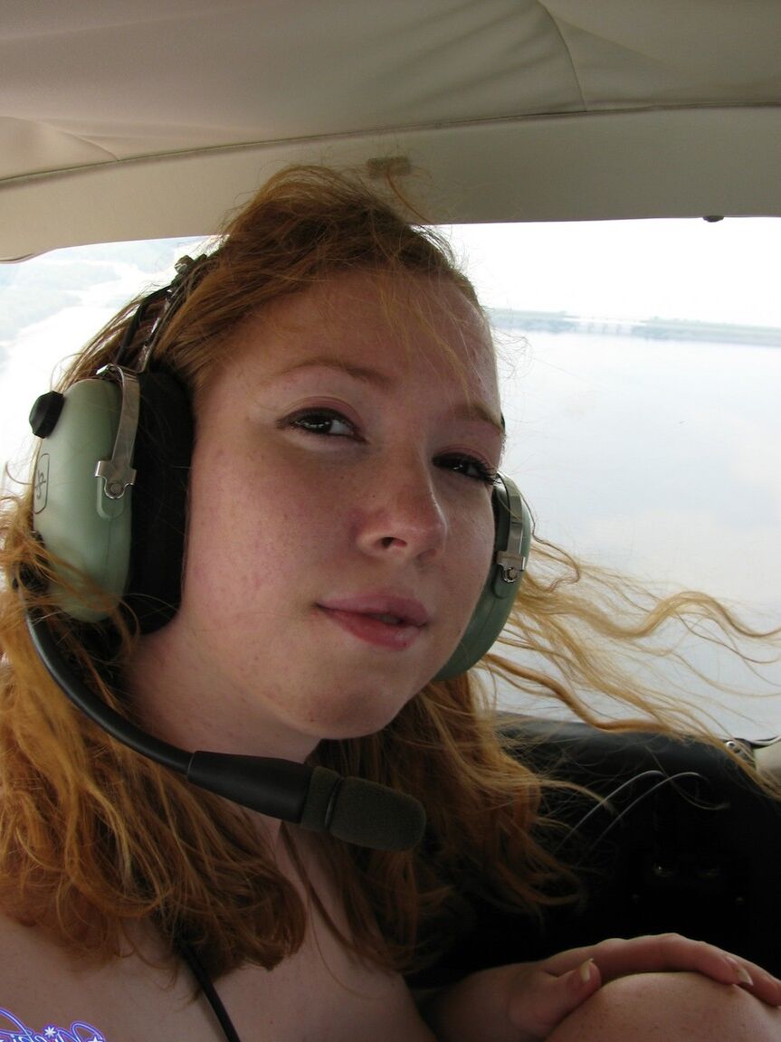 15P Natural redhead Nicki Blue gets totally naked aboard a small engine aircraft