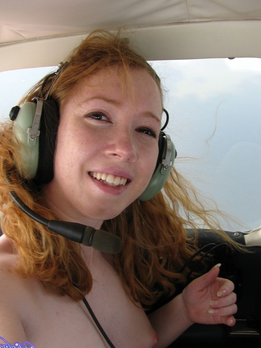 15P Natural redhead Nicki Blue gets totally naked aboard a small engine aircraft