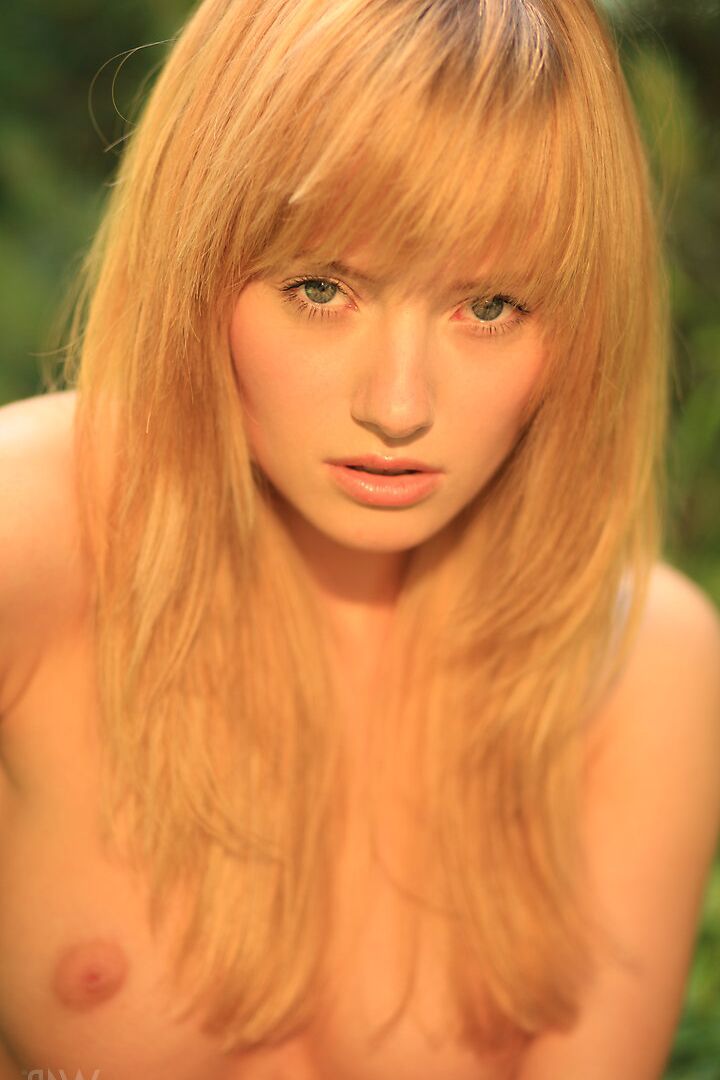 16P Young looking blonde Mia gets naked in heels while in a garden