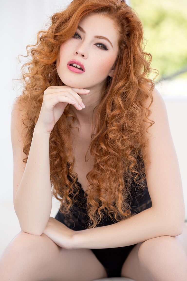16P Curly haired ginger Heidi Romanova teasing with her incredible body on sofa