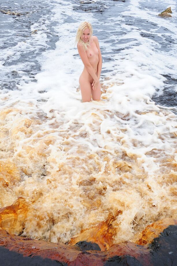 16P Young looking blonde Aleksa A stands totally naked in a shallow waterfall