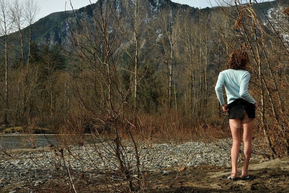 15P Seductive transwoman in stockings and sheer panties outside by a river