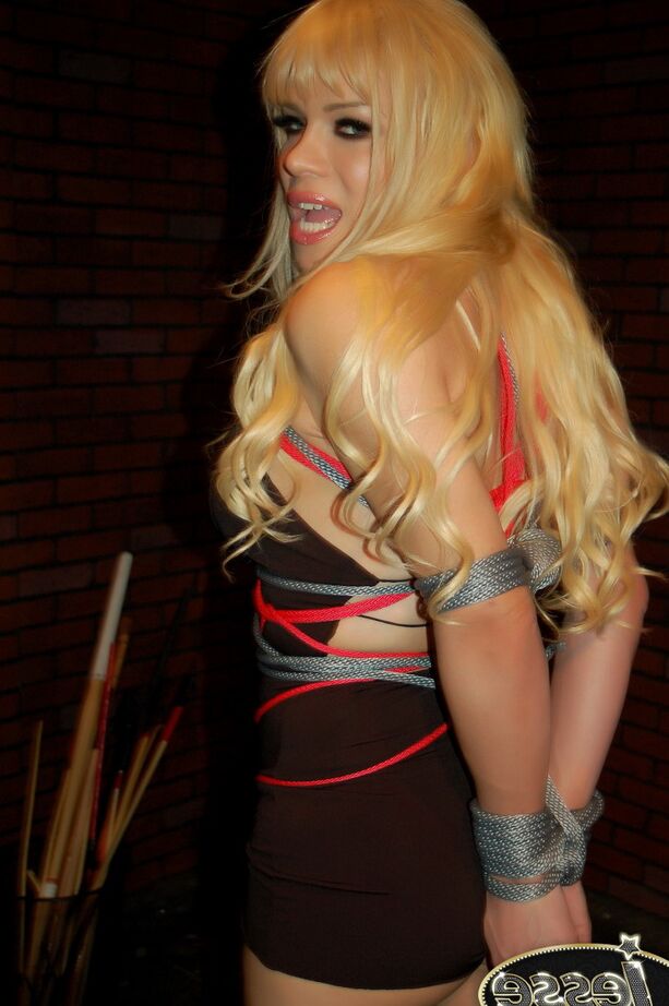 15P Tied up transsexual goddess Jesse struggling to get free