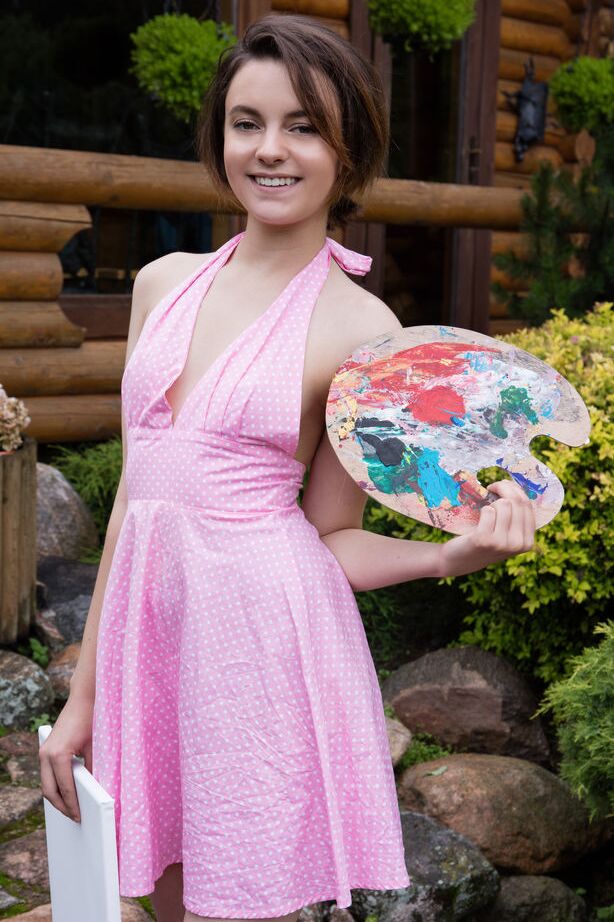 16P Nice teen Kertu gets totally naked while painting in the backyard