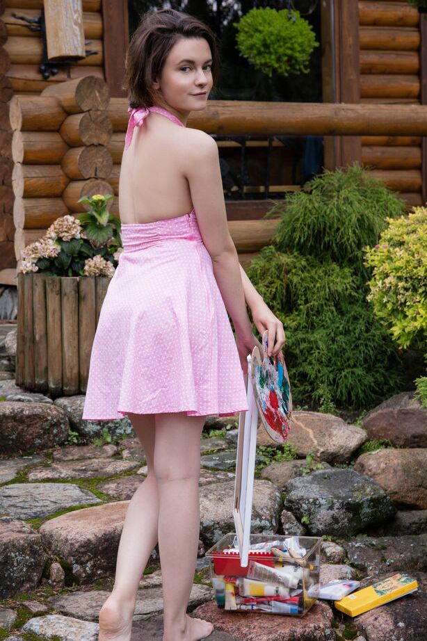 16P Nice teen Kertu gets totally naked while painting in the backyard