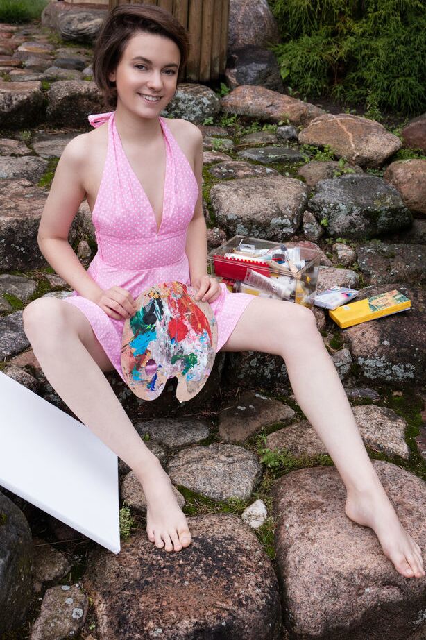 16P Nice teen Kertu gets totally naked while painting in the backyard
