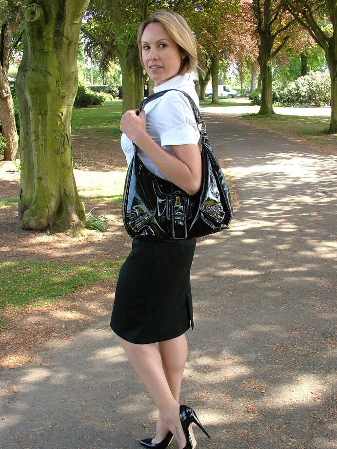 16P Fully clothed secretary Monica shows off hose clad legs in pumps on pathway